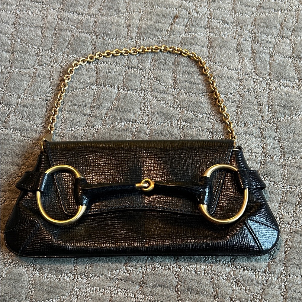 Authentic Gucci leather horsebit clutch.